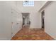 Spacious foyer featuring Saltillo tile flooring, high ceilings, and ample natural light at 3030 W Christy Dr, Phoenix, AZ 85029