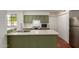 Kitchen featuring stainless steel appliances, plenty of cabinet space, white backsplash, and a double sink at 3030 W Christy Dr, Phoenix, AZ 85029