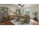 Home office with hardwood desk, swivel chairs, built-in bookshelves, and a cozy rug at 3030 W Christy Dr, Phoenix, AZ 85029