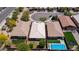 Aerial view shows the house, neighboring residences, and adjacent street in a residential neighborhood at 31318 N 26Th Dr, Phoenix, AZ 85085
