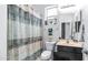 Bathroom featuring a shower and tub with a patterned shower curtain and modern sink at 31318 N 26Th Dr, Phoenix, AZ 85085