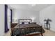 Comfortable bedroom featuring a queen-size bed and stylish bedside tables with lamps at 31318 N 26Th Dr, Phoenix, AZ 85085