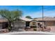 Charming single-story home with a two-car garage, xeriscaped front yard, and shuttered window accents at 31318 N 26Th Dr, Phoenix, AZ 85085