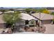 Charming single-story home with a two-car garage, xeriscaped front yard, and shuttered window accents at 31318 N 26Th Dr, Phoenix, AZ 85085