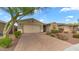 Charming home featuring a desert landscape, paver driveway and a two car garage at 31318 N 26Th Dr, Phoenix, AZ 85085