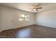 Spacious living room with beautiful hardwood floors and natural light at 3441 W Sweetwater Ave, Phoenix, AZ 85029