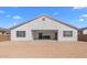 Expansive backyard featuring a blank slate of dirt, ideal for creating a personalized outdoor oasis at 37785 W Santa Maria St, Maricopa, AZ 85138
