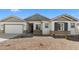 Charming single-story home with stone accents, neutral tones, and a well-maintained desert landscape at 37785 W Santa Maria St, Maricopa, AZ 85138