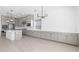 Spacious kitchen with stainless steel appliances, lots of storage, and modern lighting fixtures at 37785 W Santa Maria St, Maricopa, AZ 85138