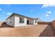 New home boasts a spacious backyard ready for landscaping and outdoor living at 37805 W Santa Maria St, Maricopa, AZ 85138