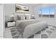 Well-lit bedroom with plush carpeting, stylish decor, and a window at 37805 W Santa Maria St, Maricopa, AZ 85138