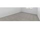 Clean, bright bedroom with light carpet and a bright window at 37805 W Santa Maria St, Maricopa, AZ 85138