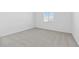 Bright bedroom with light carpet and a bright window at 37805 W Santa Maria St, Maricopa, AZ 85138