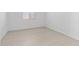 Clean, bright bedroom with light tile floors and a bright window at 37805 W Santa Maria St, Maricopa, AZ 85138
