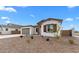 Well-maintained home featuring desert landscaping, a two-car garage, and a charming front facade at 37805 W Santa Maria St, Maricopa, AZ 85138