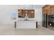 Modern kitchen with stainless steel appliances, white countertops, and stylish pendant lighting at 37805 W Santa Maria St, Maricopa, AZ 85138