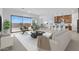 Open concept living room with tile floors and kitchen with modern island at 37805 W Santa Maria St, Maricopa, AZ 85138