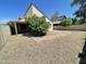 Private backyard with stone landscaping and a quaint covered patio at 3877 W Butler St, Chandler, AZ 85226