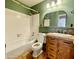 Rustic bathroom with a tub and shower, natural wood accents, and warm, earthy tones at 3877 W Butler St, Chandler, AZ 85226