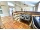 Charming kitchen with a unique vintage sink, stylish cabinetry, and a view into the living area at 3877 W Butler St, Chandler, AZ 85226