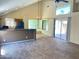 Living room showcasing abundant natural light, a ceiling fan, and a seamless flow into the dining area at 3877 W Butler St, Chandler, AZ 85226