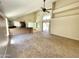 Inviting living room featuring high ceilings, ceiling fan, natural light, and access to the outdoor space at 3877 W Butler St, Chandler, AZ 85226