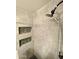 Modern shower design features tiled walls and rock-filled insets for stylish storage at 3877 W Butler St, Chandler, AZ 85226