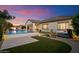 Beautiful backyard featuring a pool, hot tub, and covered patio at dusk at 3912 E Ellis St, Mesa, AZ 85205