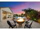 Inviting backyard with pool, fire pit, and comfortable seating area at 3912 E Ellis St, Mesa, AZ 85205