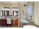 Luxurious bathroom with a soaking tub, a separate shower, and dual vanities at 3912 E Ellis St, Mesa, AZ 85205