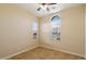 Bedroom with neutral walls, tile flooring, ceiling fan, and multiple windows for natural light at 3912 E Ellis St, Mesa, AZ 85205