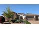 Charming single-story home with stone accents, mature trees, and a two-car garage at 3912 E Ellis St, Mesa, AZ 85205