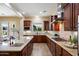 Spacious kitchen boasts custom wood cabinets, granite countertops, and stainless steel appliances at 3912 E Ellis St, Mesa, AZ 85205