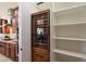 Custom wine storage rack with glass door and shelving is located in the kitchen at 3912 E Ellis St, Mesa, AZ 85205