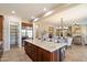 Gourmet kitchen with a large center island, stainless steel refrigerator, and open floor plan at 3912 E Ellis St, Mesa, AZ 85205