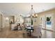 Living area featuring modern décor, neutral tones, a fireplace, and access to the pool area at 3912 E Ellis St, Mesa, AZ 85205