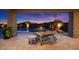 Lush backyard featuring a pool, hot tub, lounge chairs, and stunning desert scenery at 39254 N 104Th Pl, Scottsdale, AZ 85262