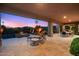 Beautiful backyard with a covered patio, hot tub, and desert landscaping, perfect for relaxation at 39254 N 104Th Pl, Scottsdale, AZ 85262