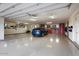 Spacious garage with epoxy flooring and custom cabinets for storage at 39254 N 104Th Pl, Scottsdale, AZ 85262