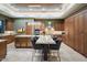 Gourmet kitchen features custom cabinets, a large island, stainless appliances, granite countertops and breakfast bar at 39254 N 104Th Pl, Scottsdale, AZ 85262