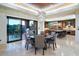 A gourmet kitchen features custom cabinets, a large island, stainless appliances, granite countertops and breakfast bar at 39254 N 104Th Pl, Scottsdale, AZ 85262
