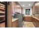 Well-organized laundry room with ample cabinet storage and granite countertops, plus modern washer and dryer at 39254 N 104Th Pl, Scottsdale, AZ 85262