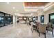 Spacious open floor plan features modern lighting, travertine floors, dining area and large windows to the outdoors at 39254 N 104Th Pl, Scottsdale, AZ 85262