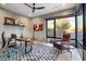 Bright home office featuring desk space, decorative lighting, and views of the desert landscape at 39254 N 104Th Pl, Scottsdale, AZ 85262