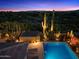 Aerial view of a pool and spa with desert landscaping, showcasing a peaceful backyard setting at 39254 N 104Th Pl, Scottsdale, AZ 85262