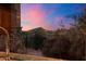 The kitchen window offers a spectacular mountain view and lush desert landscaping at 39254 N 104Th Pl, Scottsdale, AZ 85262