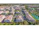 Aerial view of a neighborhood with ponds and lush landscaping at 4077 S Sabrina Dr # 14, Chandler, AZ 85248