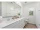 Bathroom with double sinks, ample countertop space, and wood look floors, provides a spa-like retreat at 4077 S Sabrina Dr # 14, Chandler, AZ 85248