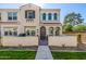 Charming two-story townhouse featuring a stucco facade, arched windows, and a landscaped front yard at 4077 S Sabrina Dr # 14, Chandler, AZ 85248