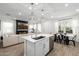 Bright kitchen featuring stainless steel appliances, white countertop island, and dining area at 4077 S Sabrina Dr # 14, Chandler, AZ 85248